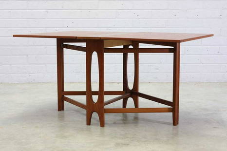 A Norwegian 'Ellipse Nr. 2' teak drop-leaf table,: A Norwegian 'Ellipse Nr. 2' teak drop-leaf table, A Norwegian 'Ellipse Nr. 2' teak drop-leaf table, 1950s, designed by Bendt Winge for Kleppes Møbelfabrikk, the leaves raised on either side by cr