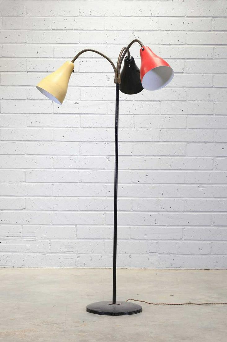 A Dutch painted metal floor lamp,: A Dutch painted metal floor lamp, A Dutch painted metal floor lamp, 1950s, the design attributed to Willem Hagoort for Hagoort Lampen, with three individually togglable shades in red, black, and yello