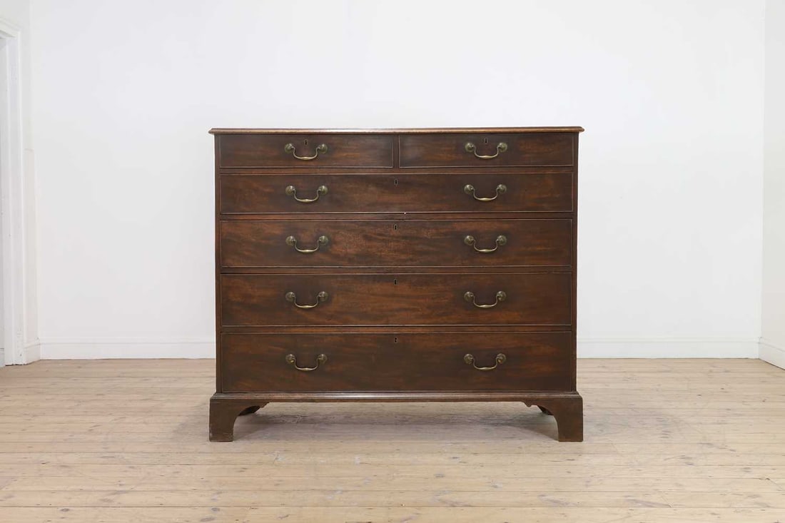 A large George III mahogany chest of drawers,: A large George III mahogany chest of drawers, A large George III mahogany chest of drawers, mid-18th century, in the manner of Thomas Chippendale, fitted with two short over four graduated long drawer