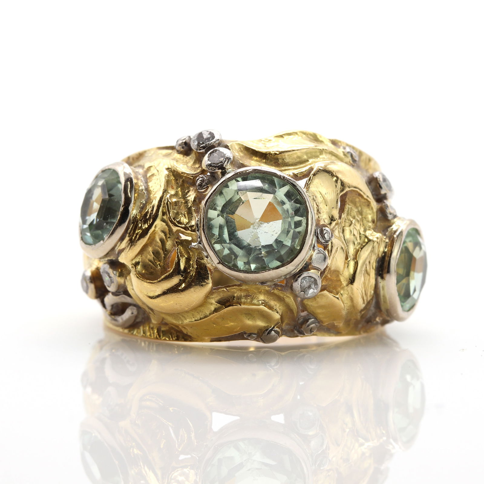 A two colour gold green beryl and diamond bombÈ ring, (1 of 3)