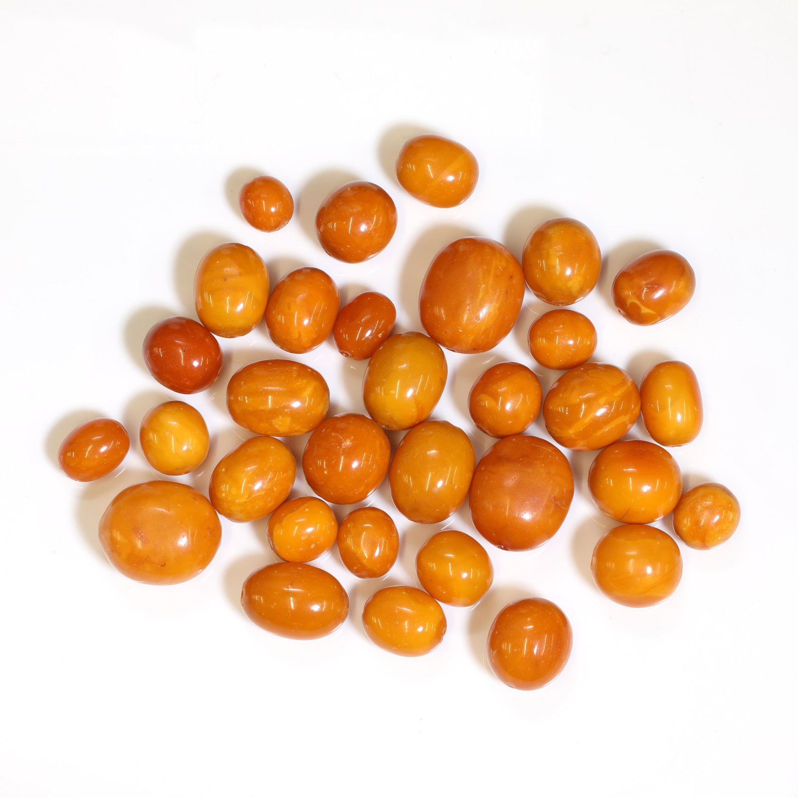 A quantity of graduated butterscotch amber beads, (1 of 1)