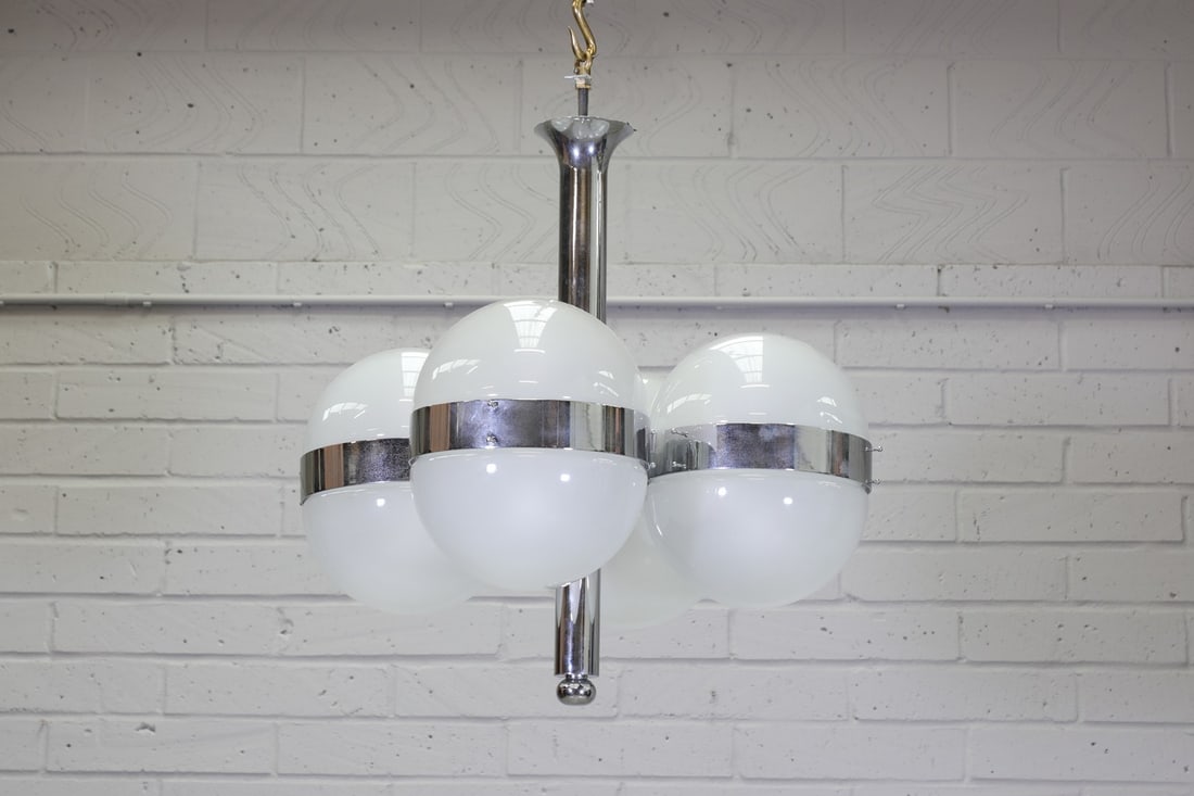 An Italian 'Tetraclio' chandelier,: An Italian 'Tetraclio' chandelier, An Italian 'Tetraclio' chandelier, designed by Sergio Mazza for Artemide in 1961, with chrome mounts with white opaline glass shades, 72cm diameter 76cm high Conditi