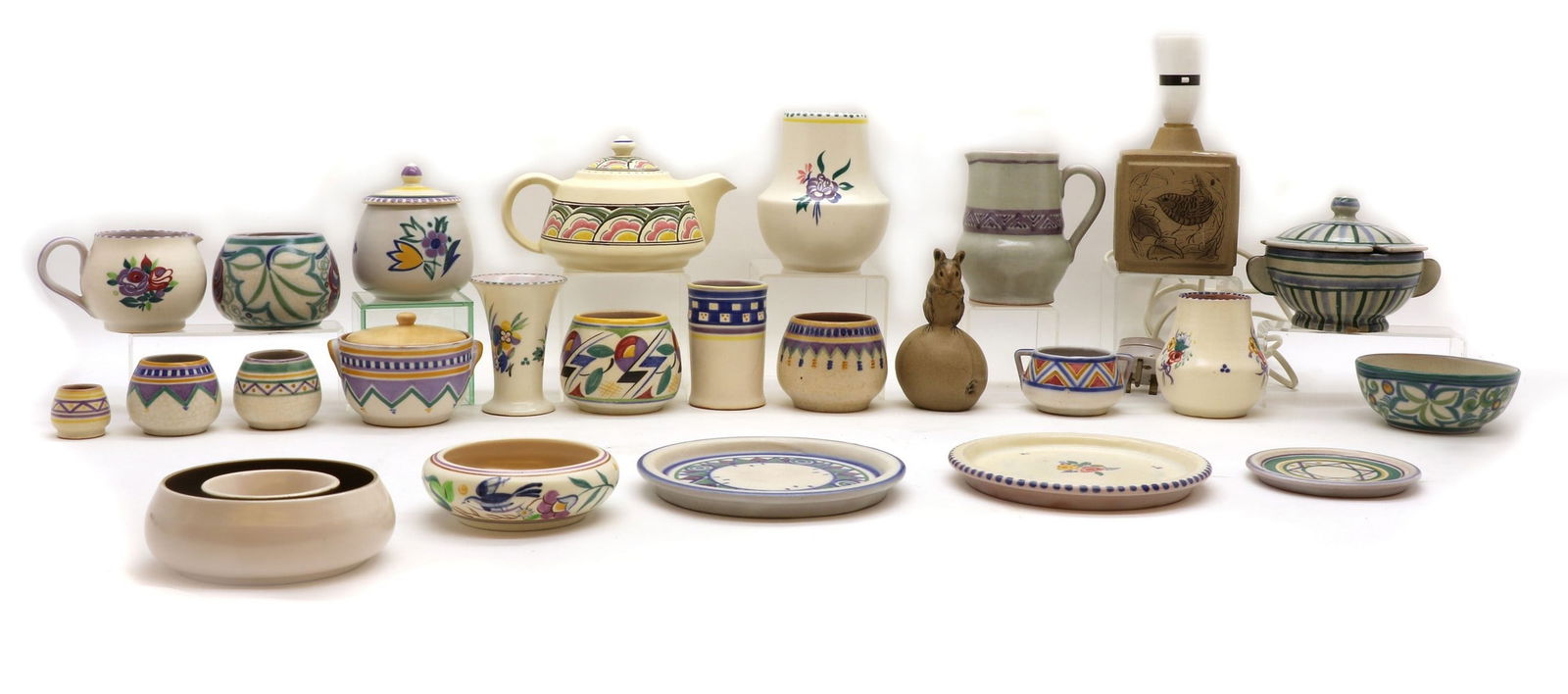 A large collection of Poole pottery items: A large collection of Poole pottery items A large collection of Poole pottery items, impressed marks, comprising; Carter, Stables & Adams examples comprising a James Radley Young blue striped pot and