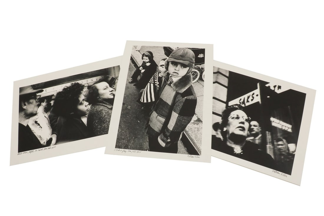 William Klein (American, b.1928): William Klein (American, b.1928) William Klein (American, b.1928) 'Black Woman Profile in Crowd' 'Woman and Saks' '3 Kids and Flag' three Iris prints, 2001, all signed and titled in black pen, from an