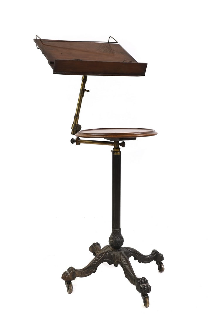 A Victorian mahogany and cast iron telescopic music stand,: A Victorian mahogany and cast iron telescopic music stand, A Victorian mahogany and cast iron telescopic music stand, manufactured by John Carter, the mahogany top raised on a brass, joined to a cast