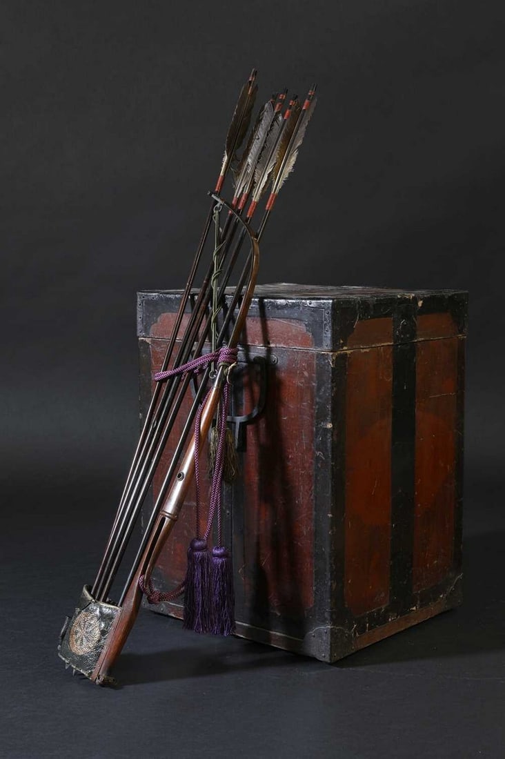 A Japanese ebira (quiver) and five arrows,: A Japanese ebira (quiver) and five arrows, A Japanese ebira (quiver) and five arrows, Edo period (1603-1868), the leather pouch decorated with a gilt mon, and purple braid, with steel tip arrows, to i