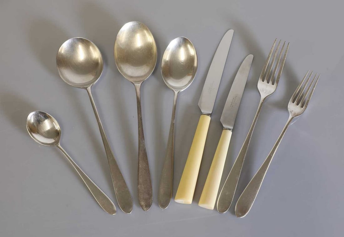 A twelve-setting canteen of silver-plated 'Pride' cutlery,: A twelve-setting canteen of silver-plated 'Pride' cutlery, A twelve-setting canteen of silver-plated 'Pride' cutlery, designed in 1953 by David Mellor for Walker & Hall, comprising: dinner knives, but