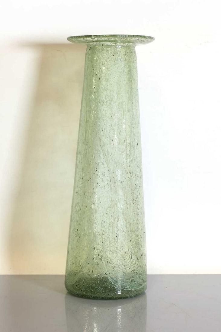 A 'Clutha' glass vase,: A 'Clutha' glass vase, A 'Clutha' glass vase, attributed to George Walton (1867-1933) for James Couper & Son, of tapering form with a wide dished rim, in mottled-green glass with milky swirls and air