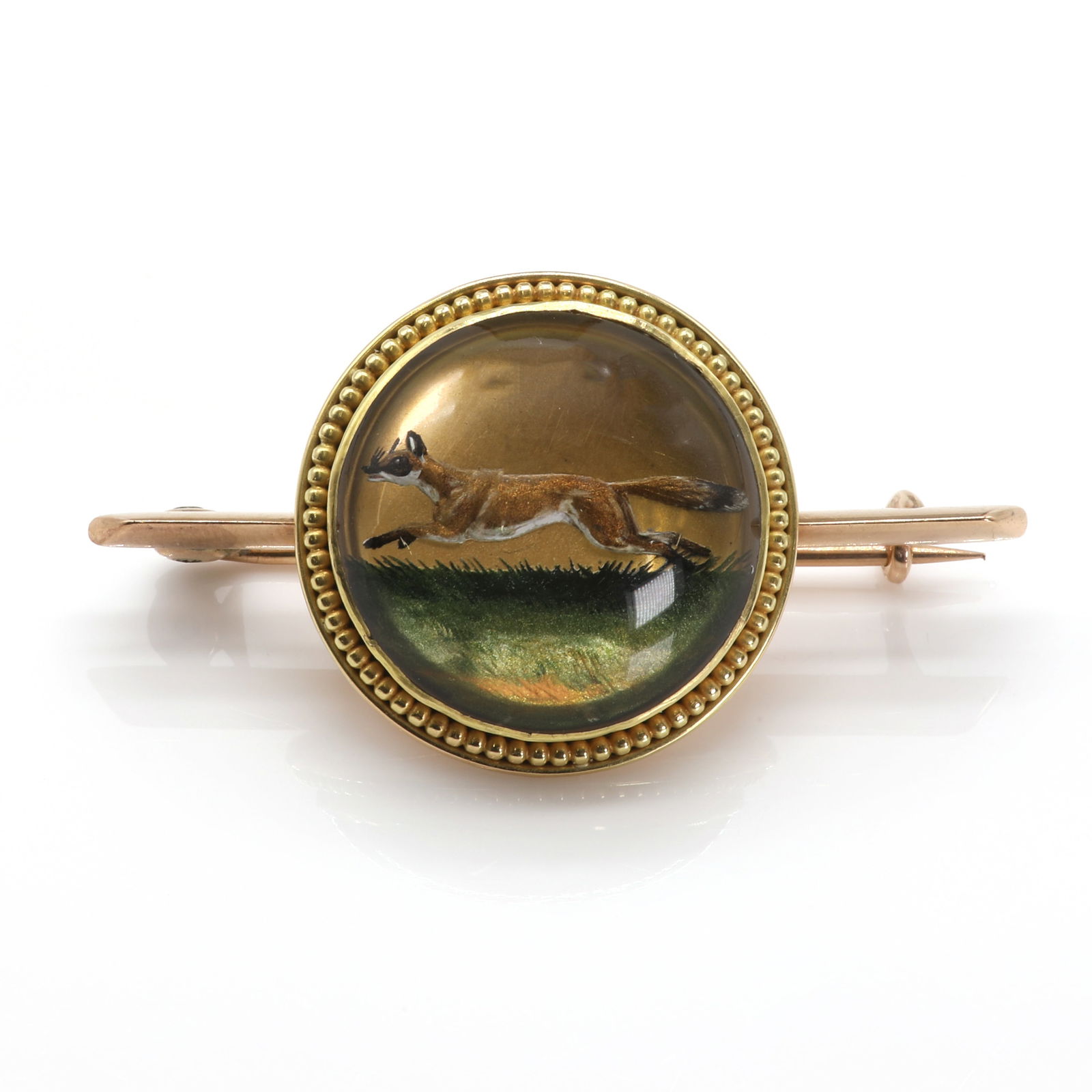 A reverse painted crystal intaglio hunting brooch, (1 of 2)