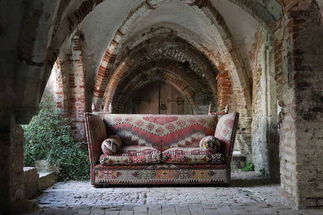 A kilim-upholstered Knole sofa by George Smith: A kilim-upholstered Knole sofa by George Smith A kilim-upholstered Knole sofa by George Smith, late 20th century, with two loose bolster cushions, 206cm wide 106cm deep 116cm high Provenance: Roger