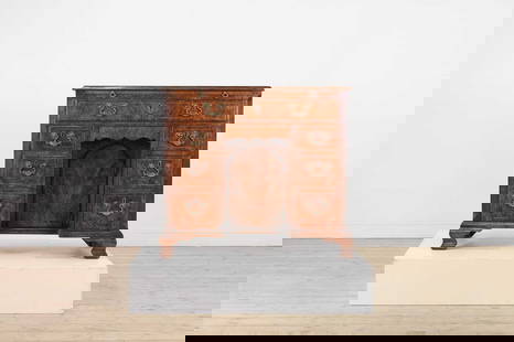 A George II figured walnut kneehole desk,: A George II figured walnut kneehole desk, A George II figured walnut kneehole desk, c.1740, the moulded rectangular top above a brushing slide and an arrangement of drawers and a cupboard, all with el
