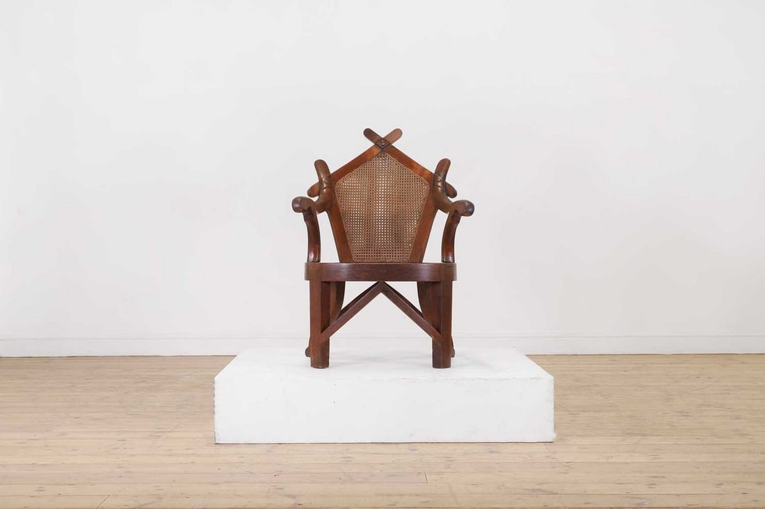 A teak elbow chair by J M Edmond of Calcutta, (1 of 7)