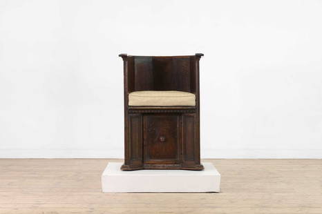 A walnut 'sedile a pozzetto' chair,: A walnut 'sedile a pozzetto' chair, A walnut 'sedile a pozzetto' chair, 17th century, Italian, Tuscany, the panelled tub back over a solid seat and base, fitted with a single cupboard, 59cm wide 47cm