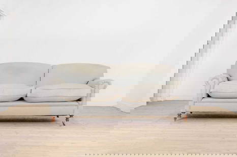 A two-seater sofa by George Smith,: A two-seater sofa by George Smith, A two-seater sofa by George Smith, of recent manufacture, upholstered in blue fabric with scroll arms and ring-turned supports, terminating in brass caps and castors