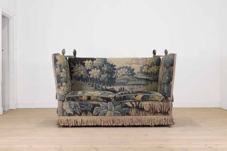 A two-seater ‘Knole’ sofa,: A two-seater ‘Knole’ sofa, A two-seater ‘Knole’ sofa, 20th century, upholstered with a late 17th-century Flemish verdure tapestry, with tasselled fringe detail, 157cm wide