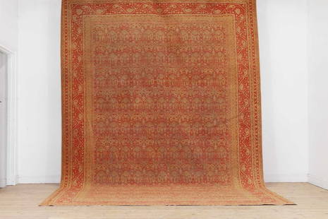 An Amritsar carpet,: An Amritsar carpet, An Amritsar carpet, c.1900, North Indian, woven with foliate motifs to a red and orange ground, 462 x 320cm Provenance: A private collection, Mayfair, London W1; acquired by the