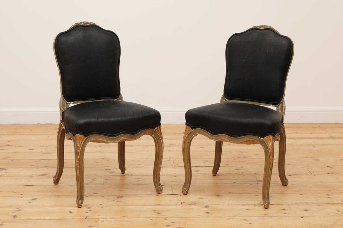 A pair of painted and parcel-gilt side chairs,: A pair of painted and parcel-gilt side chairs, A pair of painted and parcel-gilt side chairs, 18th century, North Italian, probably Genoa, each with an acanthus-carved top rail and cabriole supports, 
