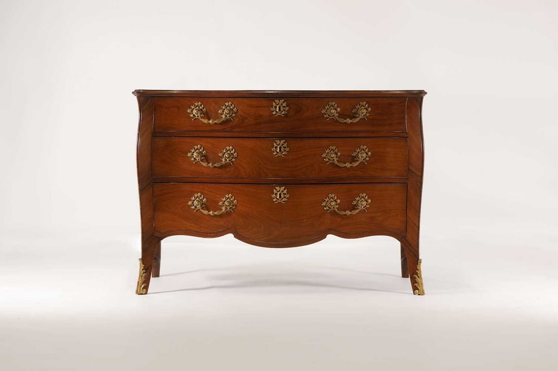 A George III padouk and kingwood commode attributed to John Cobb,: A George III padouk and kingwood commode attributed to John Cobb, A George III padouk and kingwood commode attributed to John Cobb, c.1765, of serpentine outline with ormolu mounts, the matched-veneer