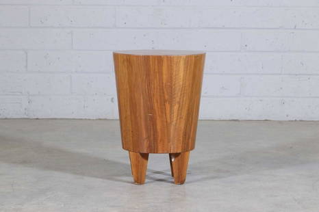 A walnut stool,: A walnut stool, 1970s, in the manner of Michel Boyer, of flaring form, raised on four feet, 34cm diameter 48cm high