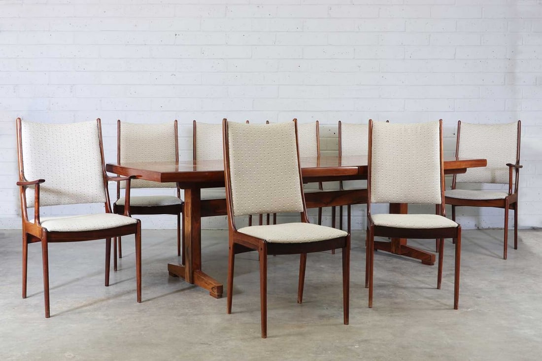 An Archie Shine rosewood dining suite,: An Archie Shine rosewood dining suite, 1970s, designed by Robert Heritage, retailed by Heal's, comprising: an extending dining table, the superelliptical top raised on 'T' shaped supports, the top sep