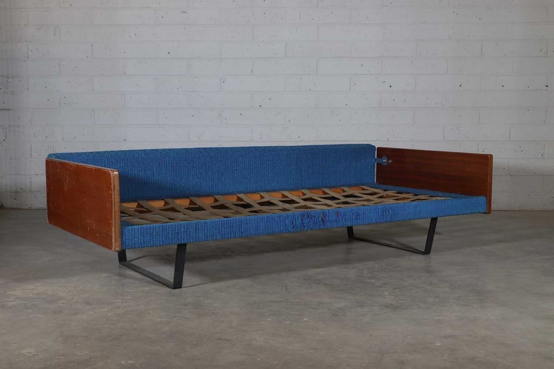 A daybed,: A daybed, designed by Robin Day (1915-2010) for Hille, with blue wool upholstered rest, with latticed web straps, 195cm wide 85cm deep 68cm high, seat 27.5cm high Condition Report: Lacking cushion sea