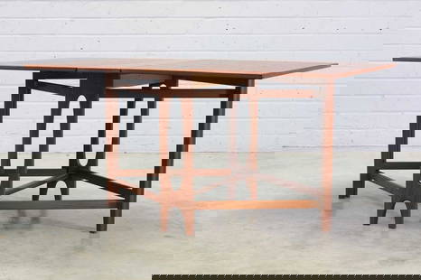 A Norwegian 'Ellipse Nr. 2' teak drop-leaf table,: A Norwegian 'Ellipse Nr. 2' teak drop-leaf table, 1950s, designed by Bendt Winge for Kleppes Møbelfabrikk, the leaves raised on either side by crossed supports, the central section raised on scul