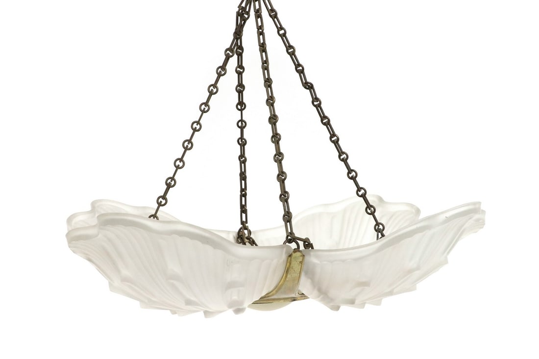 An Art Deco moulded glass ceiling light,: An Art Deco moulded glass ceiling light, mounted with four moulded glass panels, and centred with a frosted circular panel, 50cm diameter approx Condition Report: Brass arms, copper finished ceiling c