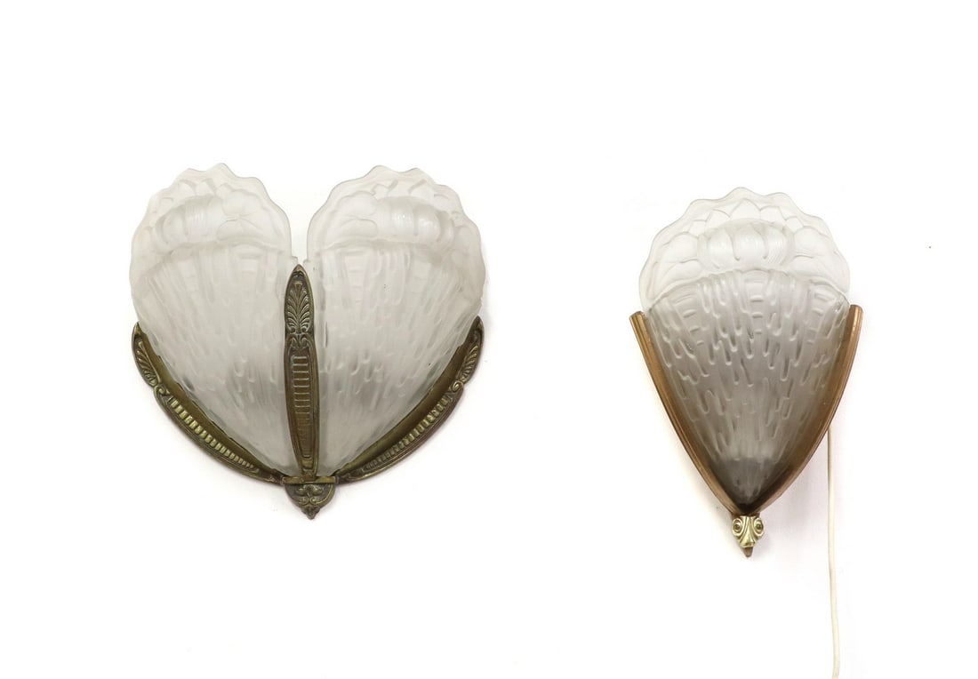 Two matched Art Deco wall lights,: Two matched Art Deco wall lights, each mounted with moulded and frosted glass panels, one with a single panel, mounted on a gold and painted wood mount, the other with two glass panels, on brass mount