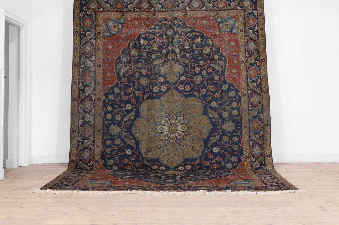 A Persian wool carpet, (1 of 5)