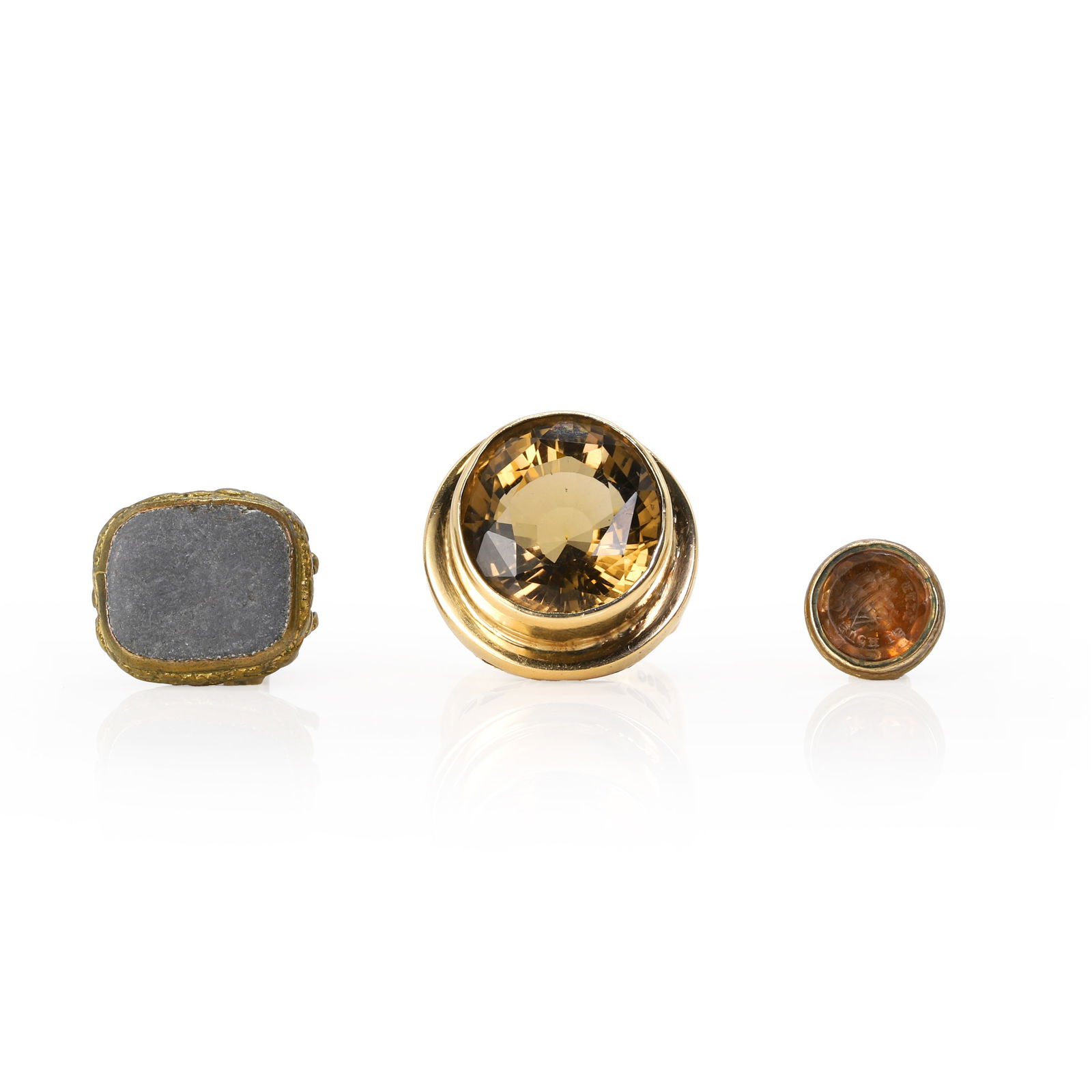 A 9ct gold smoky quartz ring and two base metal fobs, (1 of 3)