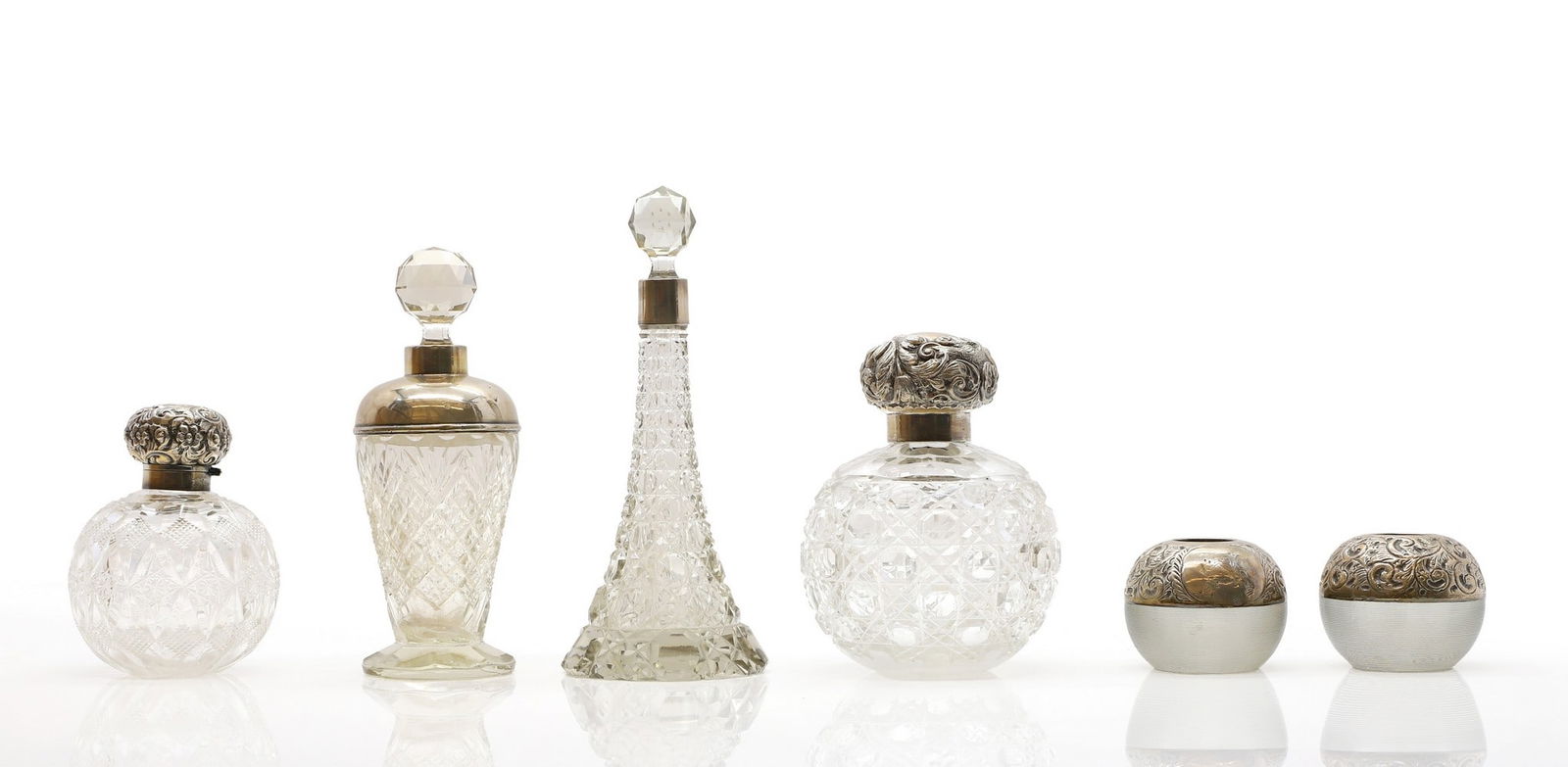 A collection of silver mounted glass scent bottles, (1 of 4)