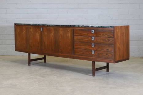 An Archie Shine rosewood sideboard,: An Archie Shine rosewood sideboard, 1960s, designed by Robert Heritage, with a green marble top over a pair of cabinet doors, flanked to the right by four drawers, throughout with nickel-plated