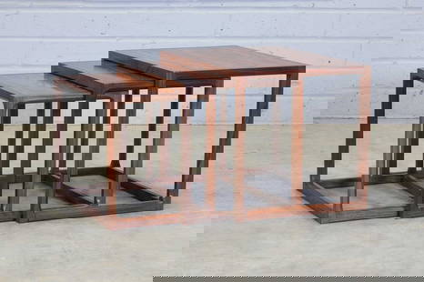 § A Danish rosewood nest of three tables,: § A Danish rosewood nest of three tables, 1970s, designed by Aksel Kjersgaard for Feldballes Møbelfabrik, each with chamfered supports, 59.5cm wide 43.5cm deep 44.5cm high (3) Condition Repo
