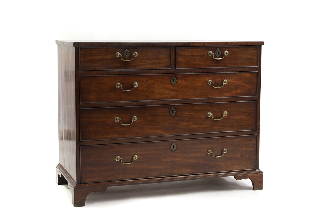 A George III mahogany chest of drawers: A George III mahogany chest of drawers of four graduated drawers on bracket feet, pine sides, 74.5cm wide 47.5cm deep 81cm high Condition Report: Handles later. Pine lined drawers run smoothly, all wi