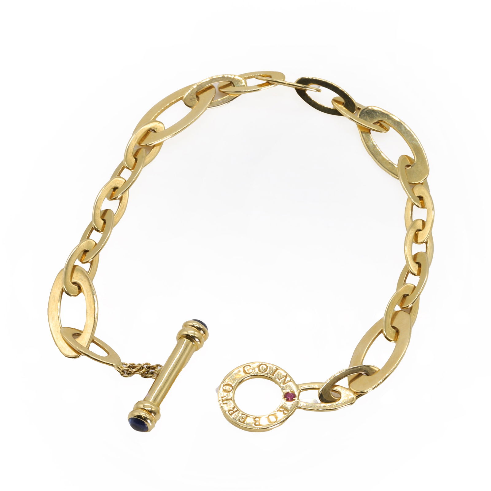 An 18ct gold 'Chic and Shine' link bracelet, by Roberto Coin,: An 18ct gold 'Chic and Shine' link bracelet, by Roberto Coin, with alternating vari-sized oval links, to a toggle clasp bezel set with round sapphire cabochon terminals, 180mm long, London 2014, 9.75g