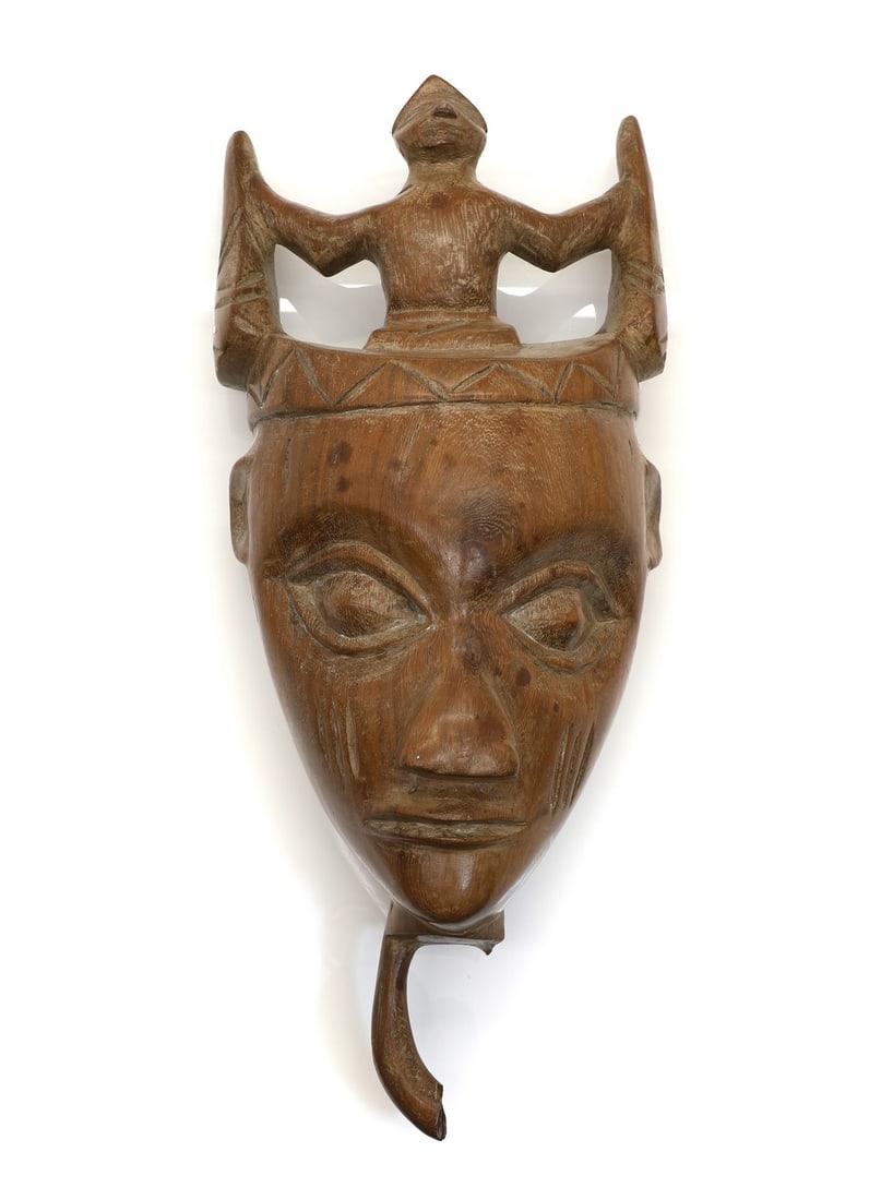 A Dan society anthropomorphic mask, (1 of 2)