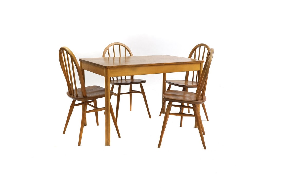 An Ercol elm and beechwood table and chairs: An Ercol elm and beechwood table and chairs table 108cm wide 69cm deep 71cm high chairs 39cm wide 40cm deep 84.5cm high seat 43cm high