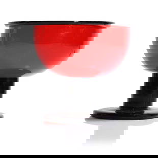 Ettore Sottsass (Italian, 1917-2007),: Ettore Sottsass (Italian, 1917-2007), 'Alucia', 1972, produced 1974-1976 by Vistosi Murano, the red incalmo glass bowl with a black rim, raised on a black glass stem and foot, etched 'E. Sottsass 24/2