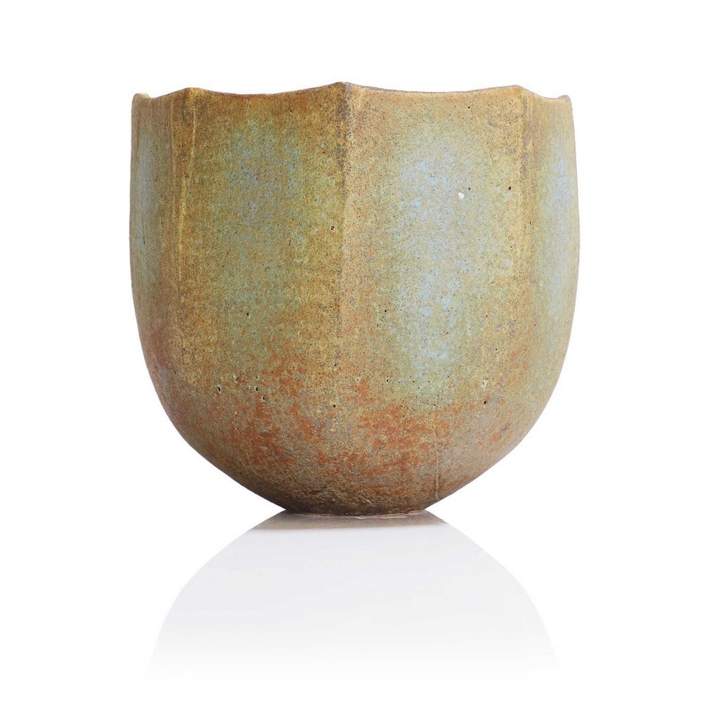 ▲ John Ward (1938-2023),: ▲ John Ward (1938-2023), a stoneware pot, in mottled matt brown and turquoise green glazes over a textured surface, the rounded base into an octagonal body, with a shaped rim, impressed seal 'J'