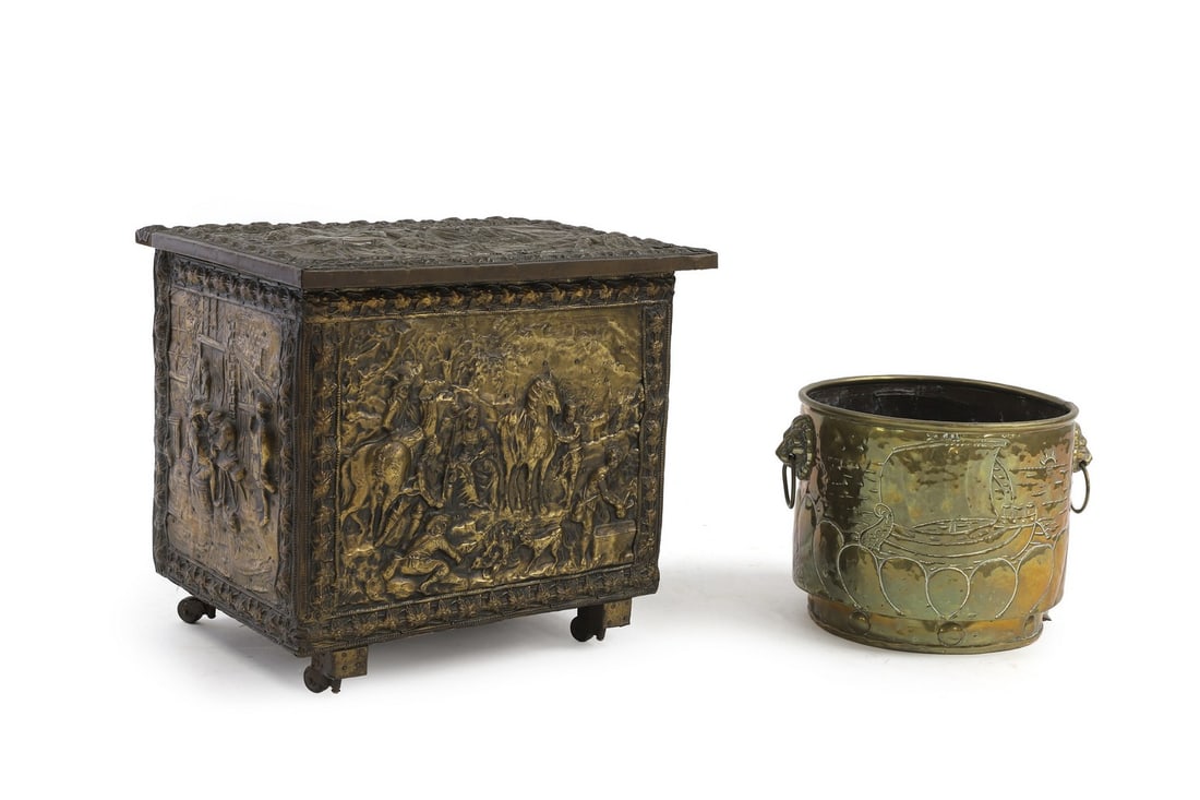 A Dutch cooper log bin: A Dutch cooper log bin with brass ship decoration with, twin lion mask handles, 33.5cm wide, together with a brass covered box on casters, with lid, ivy decoration to the borders, and figural depictio