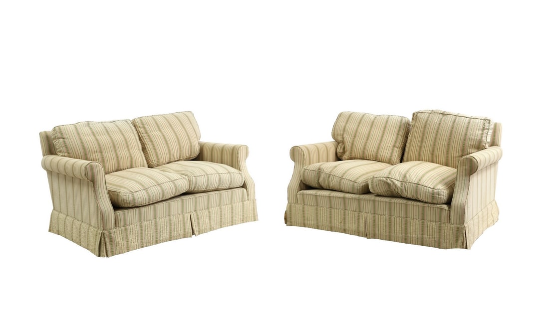 A pair of sofas by Duresta: A pair of sofas by Duresta with striped fabric, with skirt to the base, terminating in casters, 136cm wide 74cm deep 74cm high Buying this antique settees could save up to 1.21 tonnes of CO2e compared