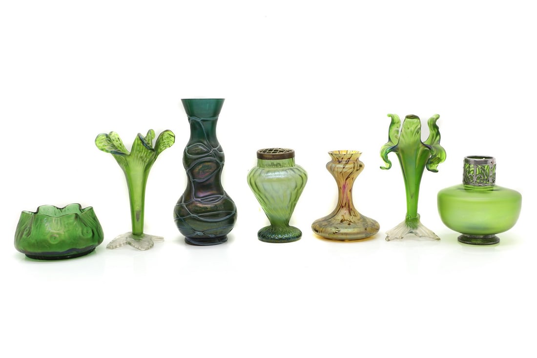 A collection of Bohemian iridescent glass: A collection of Bohemian iridescent glass early 20th century, comprising a Loetz 'Rusticana' vase, 13.5cm diameter, 7cm high, a trailed vase, attributed to Pallme Konig, 23.9cm high, and a collection