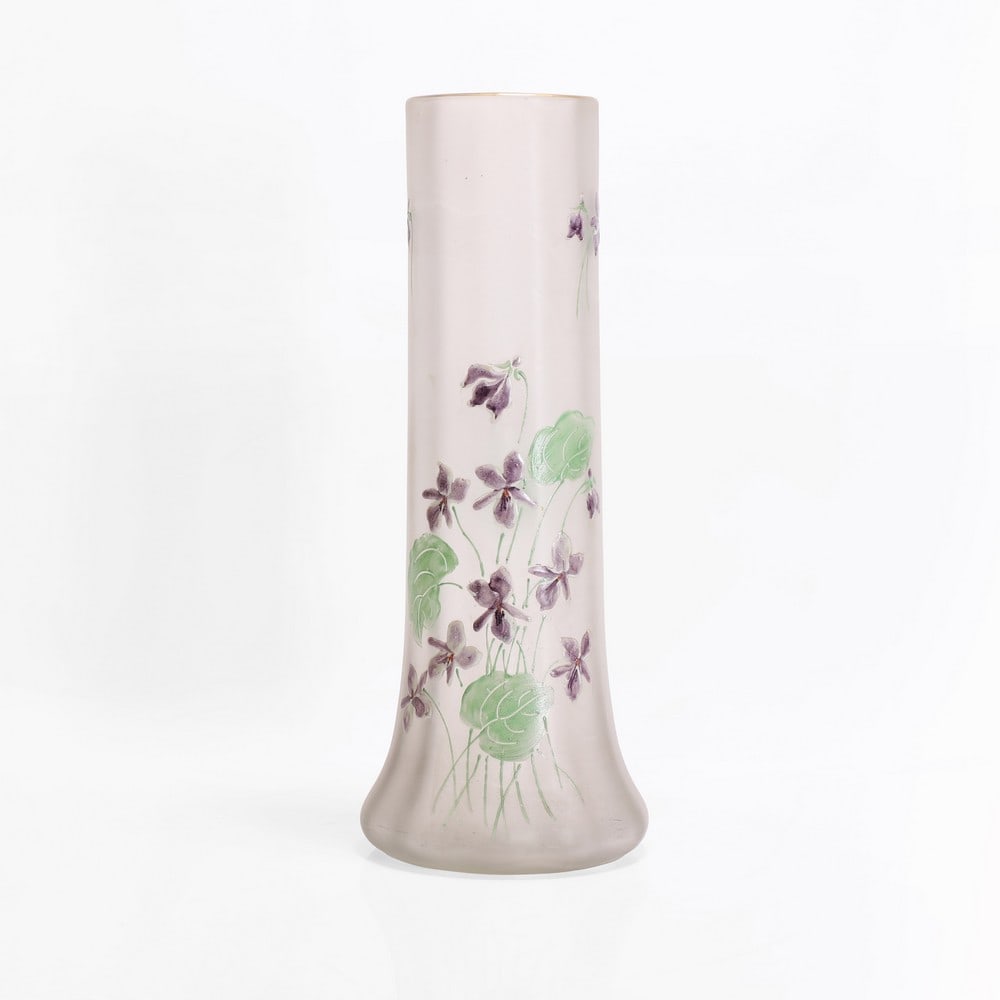 A Mont Joye enamelled glass vase,: A Mont Joye enamelled glass vase, c.1910, produced by the Auguste Légras glassworks, the squat bulbous body with a tall cylindrical faceted neck, with enamelled decoration of violets against a fr