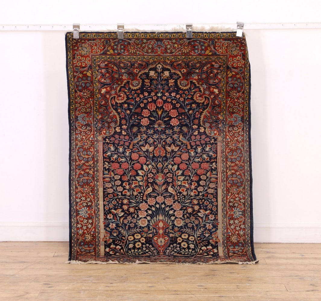 A Persian wool rug, (1 of 12)