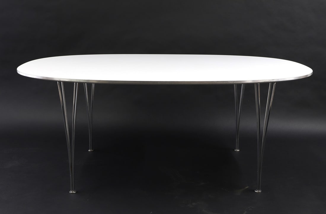 A Fritz Hansen 'Super-Ellipse' table,: A Fritz Hansen 'Super-Ellipse' table, 1980s, designed by Bruno Mathsson and Piet Hein, the superelliptical laminate top with aluminium edging, raised on chrome supports, 170cm wide 100cm deep 72cm hig
