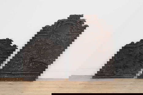 Two cast iron firebacks,: Two cast iron firebacks, 17th century, each with an arched top and relief-cast decoration, larger 56cm wide 85cm high (2)