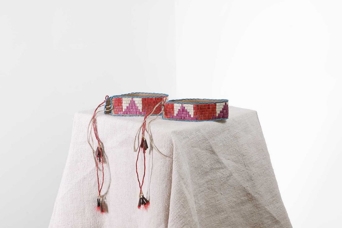 A pair of Native American quilled hide arm bands, (1 of 5)