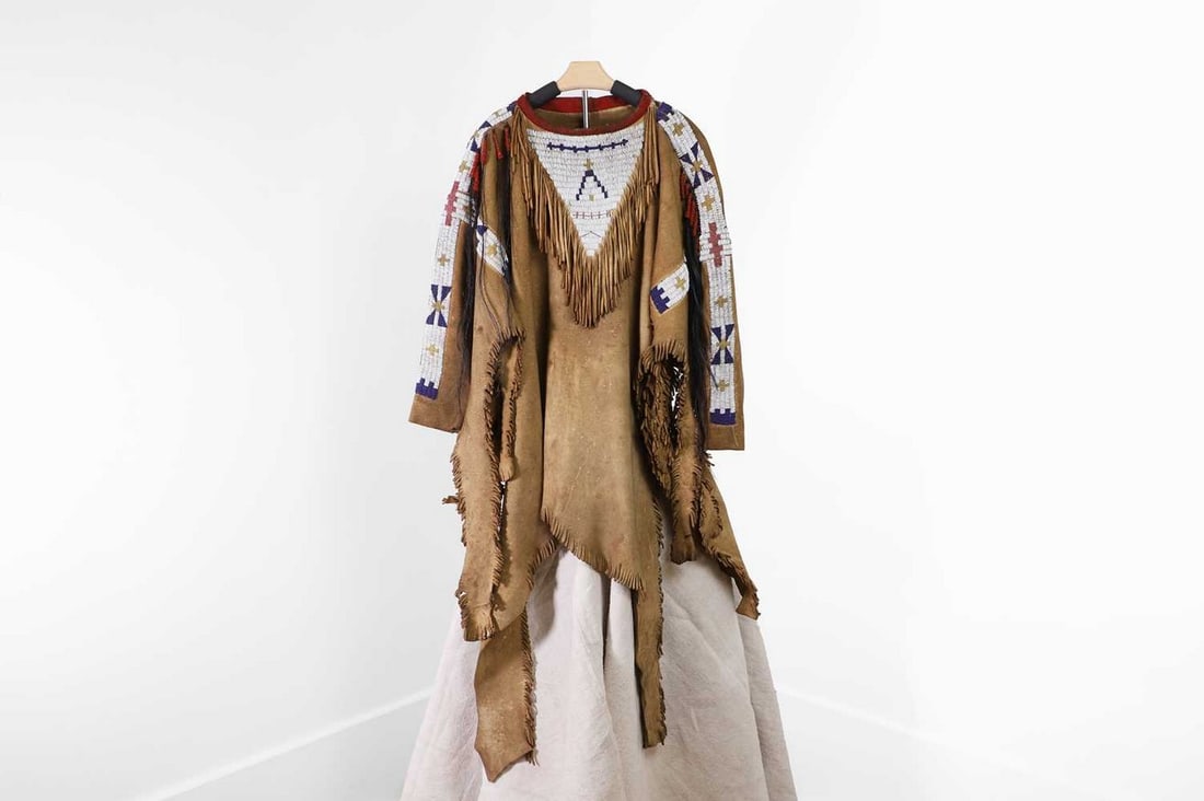 A Native American man's beaded hide war shirt, (1 of 7)