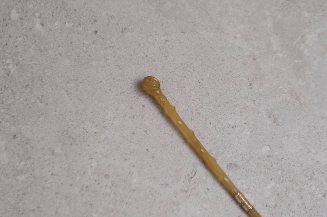 A rhino horn side-saddle whip, (1 of 3)