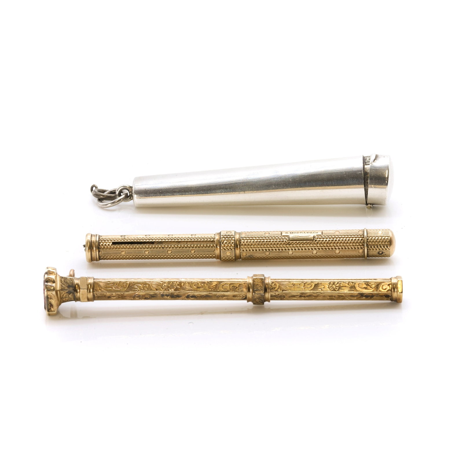 A small group of propelling pencils and needle cases,: A small group of propelling pencils and needle cases, A machine engraved dip pen/propelling pencil, by Sampson Mordan & Co., 85mm long, together with a Victorian propelling pencil, 95mm long, both tes